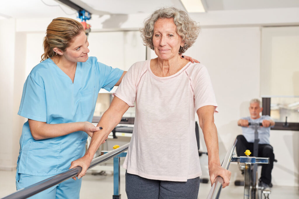 Senior woman exercising in rehab