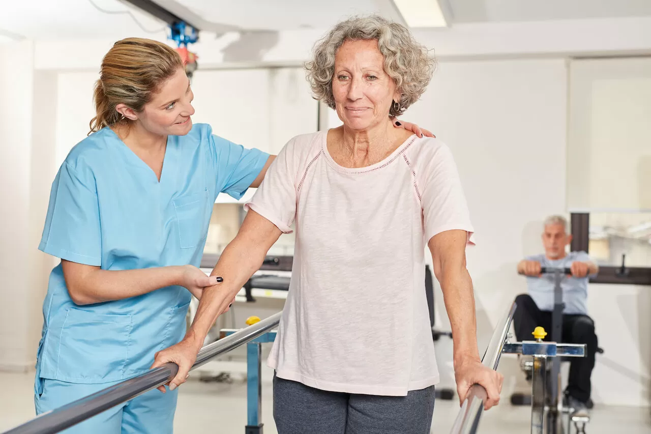 Senior woman exercising in rehab